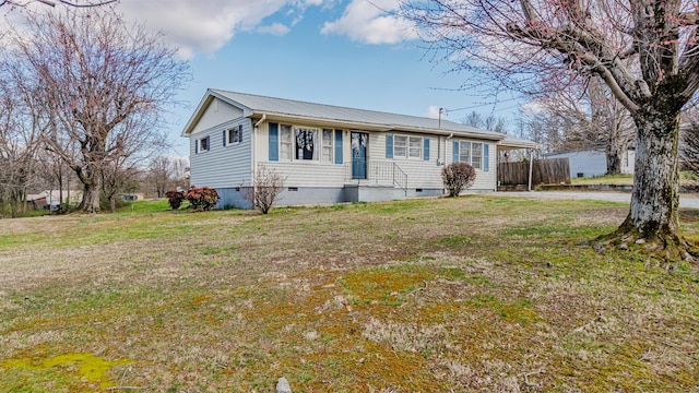 single story home featuring metal roof, a front lawn, and crawl space