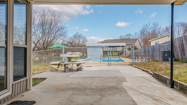 view of patio / terrace with a fenced in pool and a fenced backyard