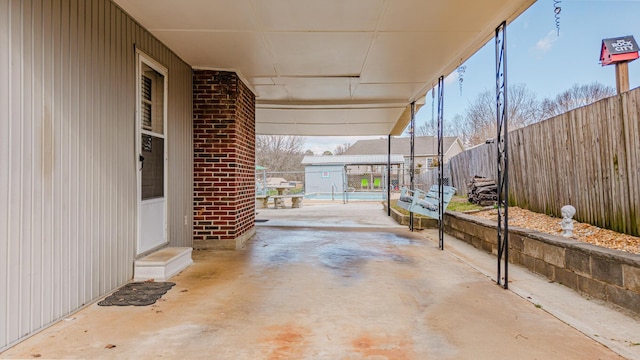 view of patio / terrace featuring fence