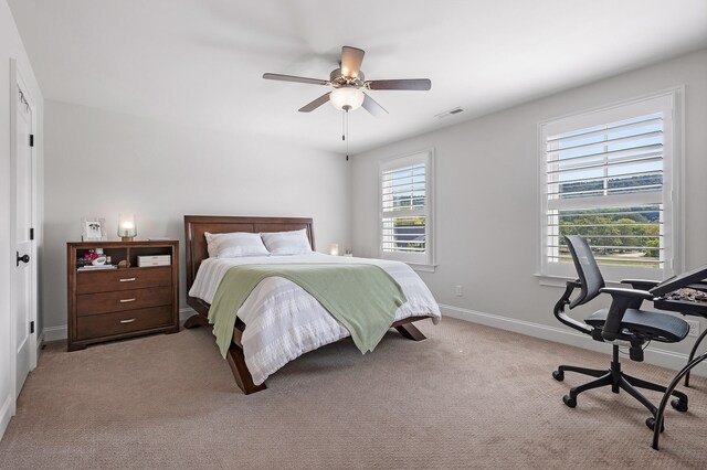 carpeted bedroom featuring ceiling fan