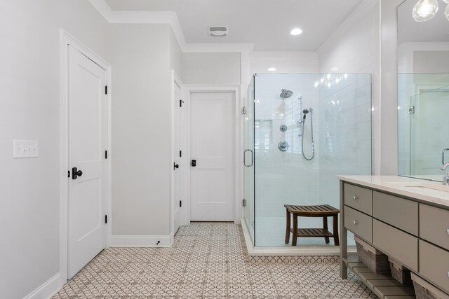 bathroom featuring tile patterned flooring, vanity, and an enclosed shower