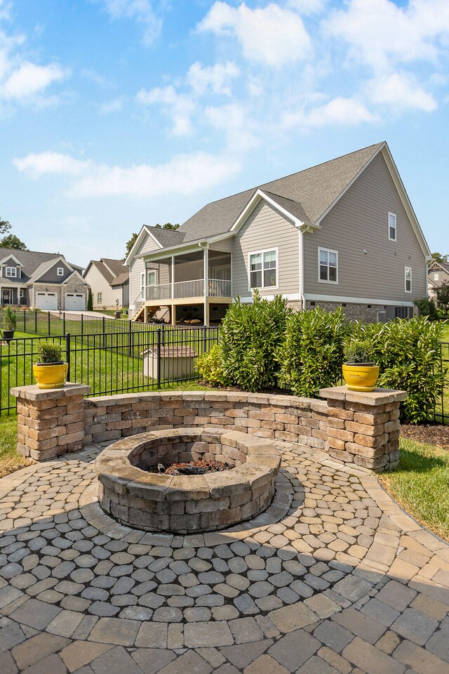 view of patio with a fire pit