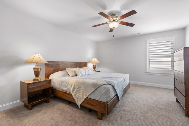 bedroom with light colored carpet and ceiling fan