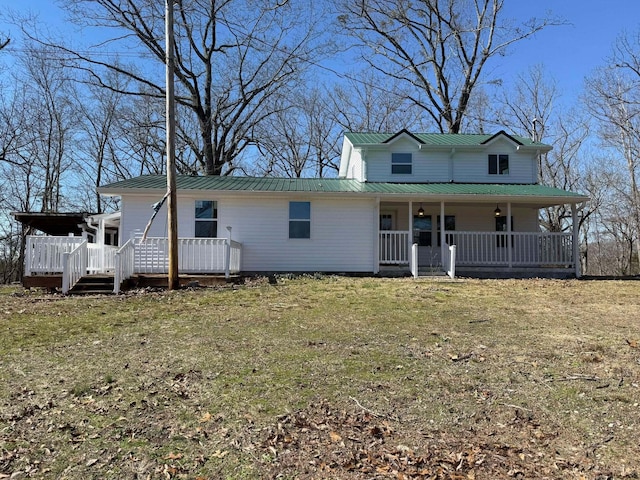 view of front of home featuring a front yard and covered porch