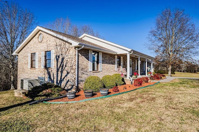 view of front of home with a porch and a front yard