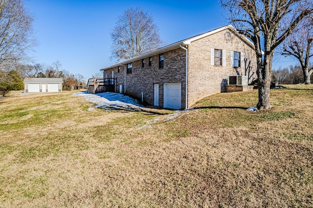 view of property exterior featuring a deck, a yard, and a garage