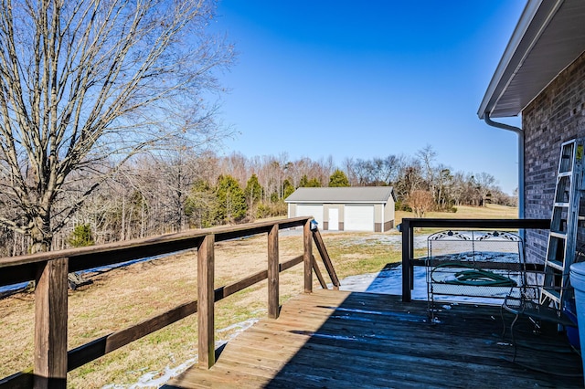 wooden deck with a yard, a garage, and an outdoor structure