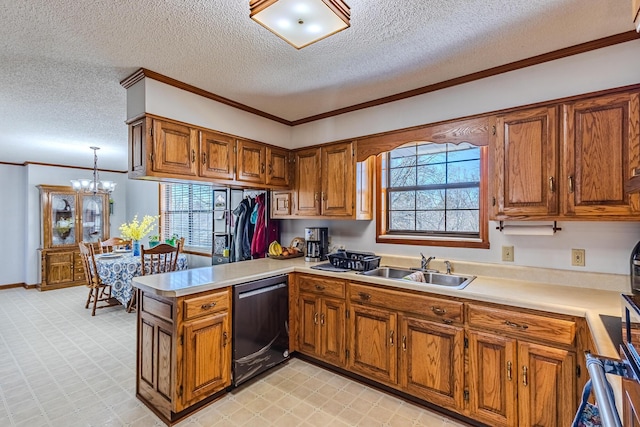 kitchen with kitchen peninsula, a notable chandelier, ornamental molding, black dishwasher, and sink