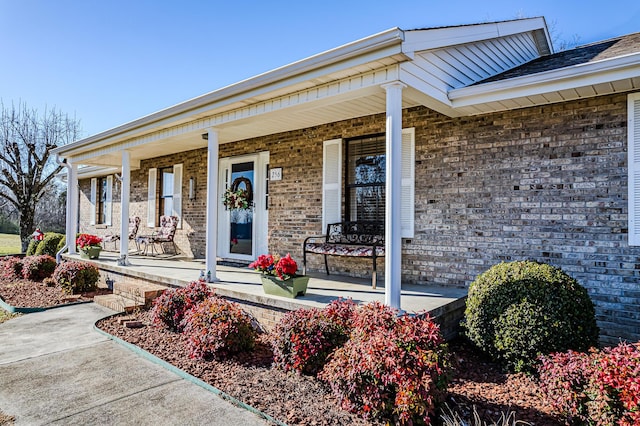 doorway to property with a porch