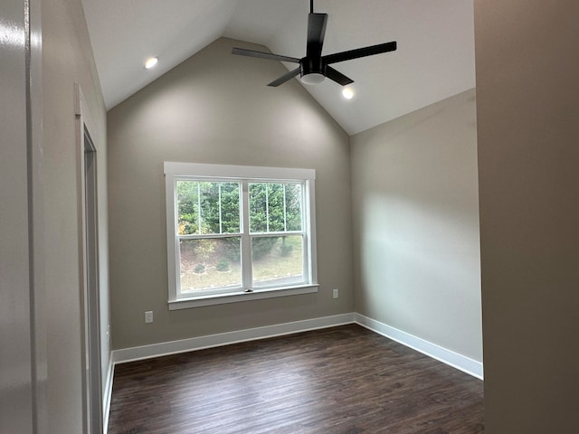 spare room with dark wood-type flooring, ceiling fan, and lofted ceiling