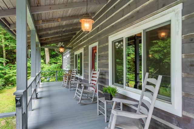 wooden terrace featuring covered porch