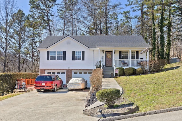 view of front facade with brick siding, a porch, concrete driveway, a front yard, and a garage