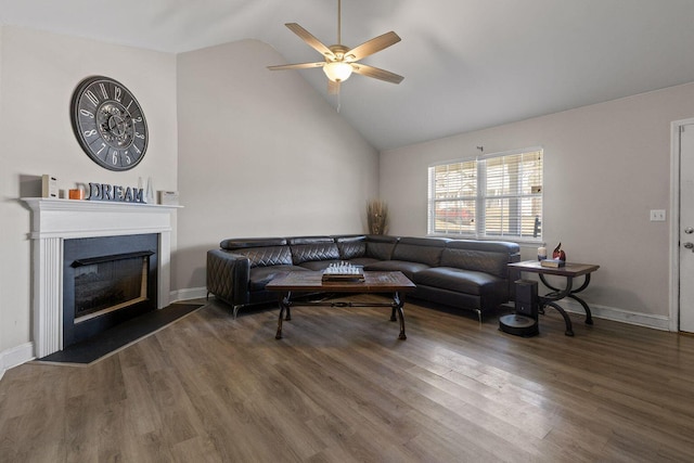 living area with high vaulted ceiling, dark wood-type flooring, a fireplace, a ceiling fan, and baseboards