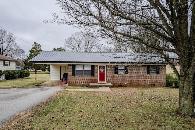 single story home featuring a front lawn and a carport