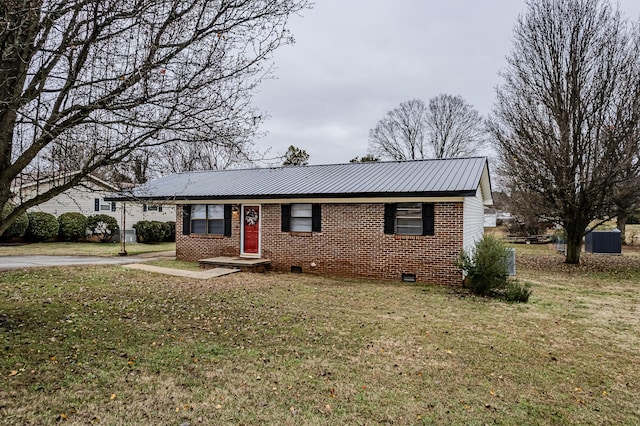 ranch-style home featuring a front yard