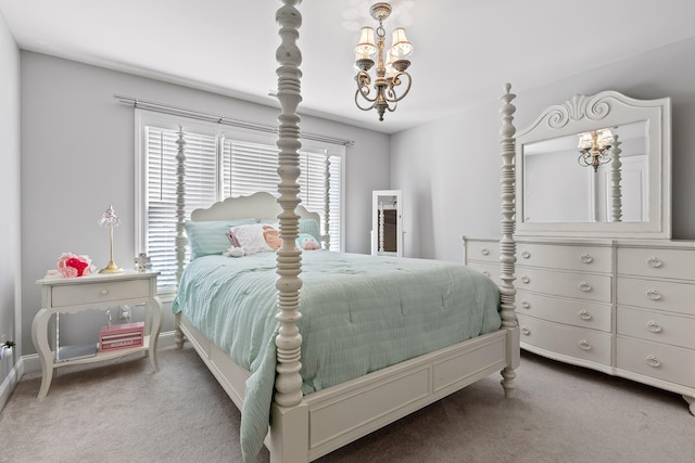 carpeted bedroom featuring a notable chandelier