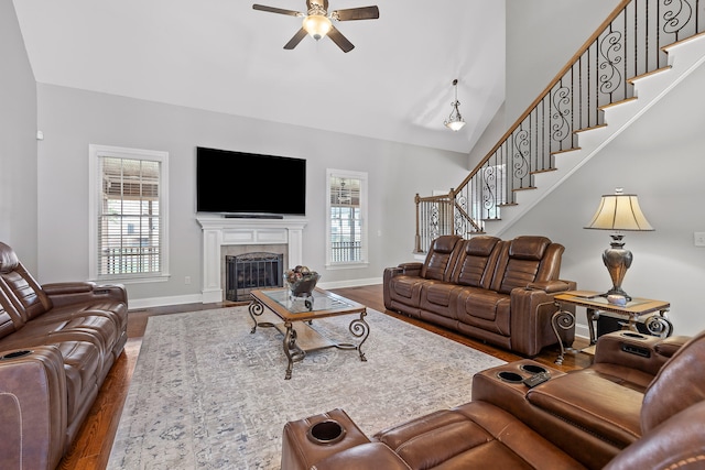 living room with hardwood / wood-style flooring and ceiling fan