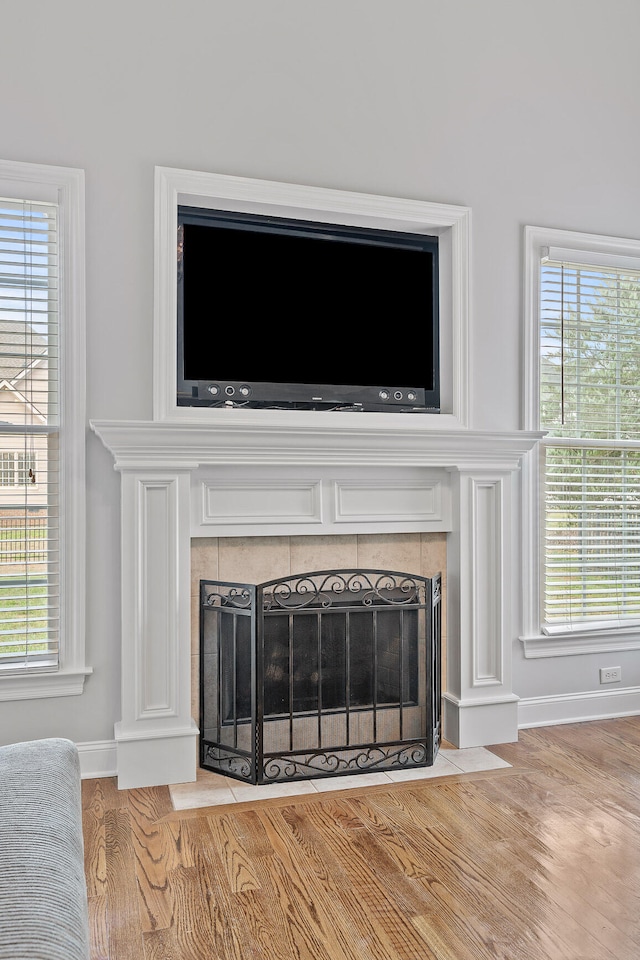 interior details featuring a fireplace and hardwood / wood-style floors