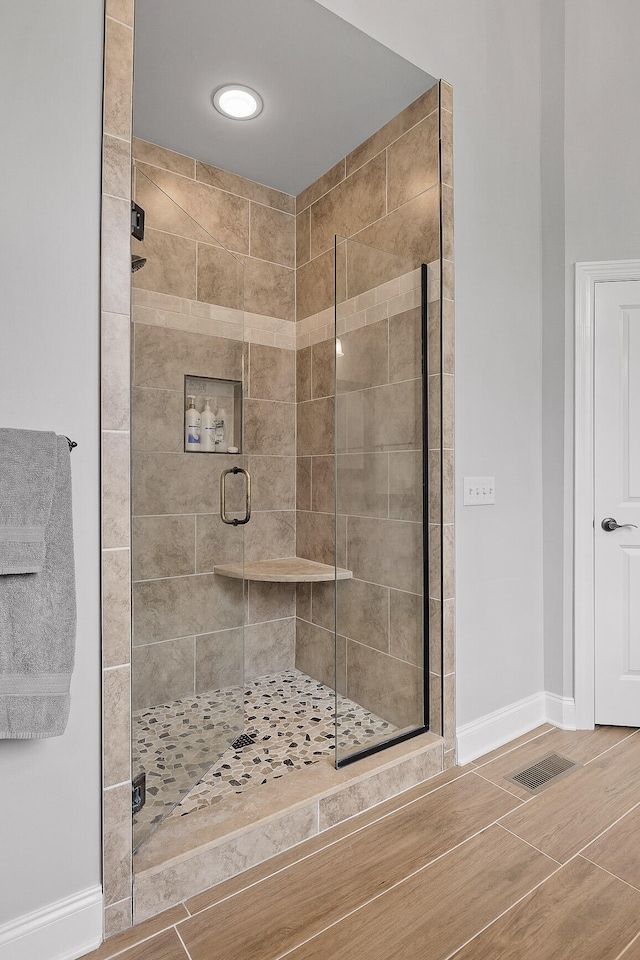 bathroom featuring an enclosed shower