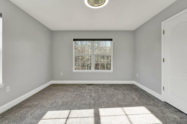 unfurnished room featuring carpet floors