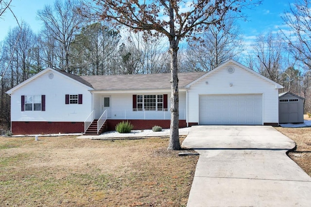 ranch-style home featuring a garage and a front yard