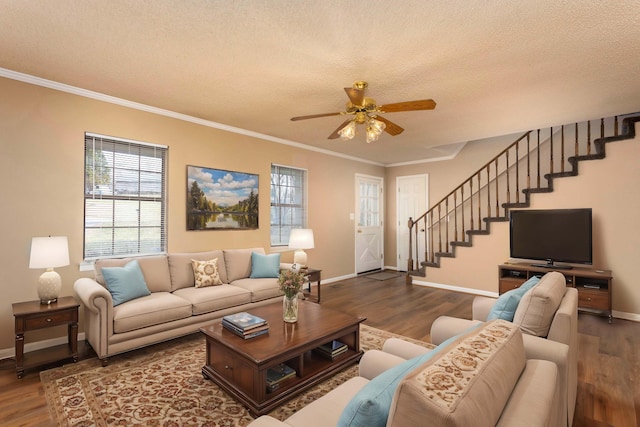 living room with hardwood / wood-style flooring, crown molding, and a textured ceiling