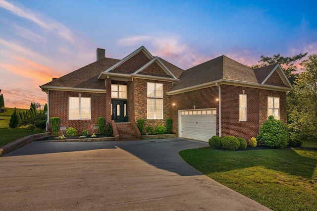 2074 Volunteer Dr SW, Cleveland, TN 37311 - view of front of house with a chimney, a yard, driveway, and brick siding