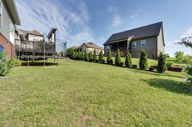 2074 Volunteer Dr SW, Cleveland, TN 37311 - view of yard featuring a sunroom, a wooden deck, and a trampoline