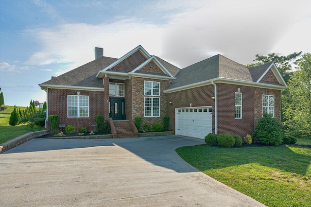 2074 Volunteer Dr SW, Cleveland, TN 37311 - craftsman inspired home featuring a garage, a front lawn, a chimney, brick siding, and driveway
