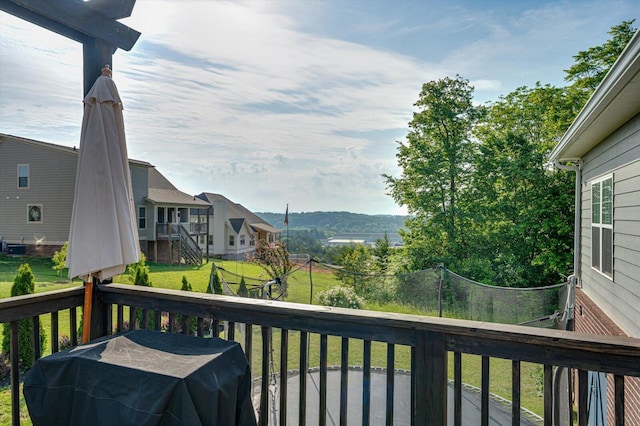 2074 Volunteer Dr SW, Cleveland, TN 37311 - wooden deck featuring a residential view, a trampoline, and a yard