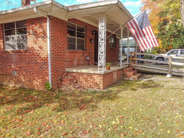 exterior space with a porch and a yard