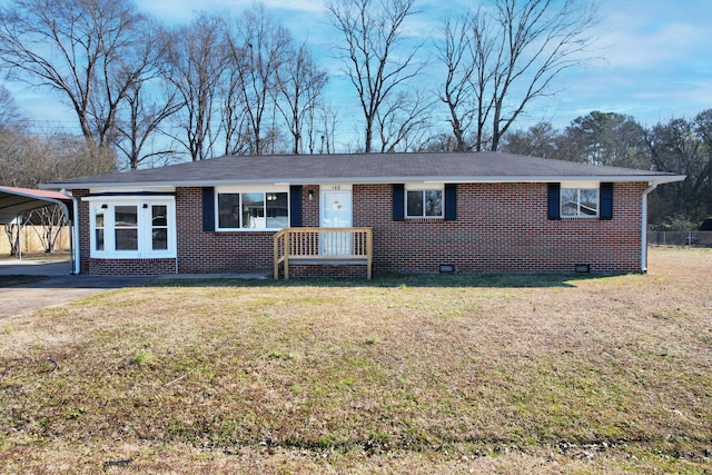 ranch-style house with a front lawn and a carport