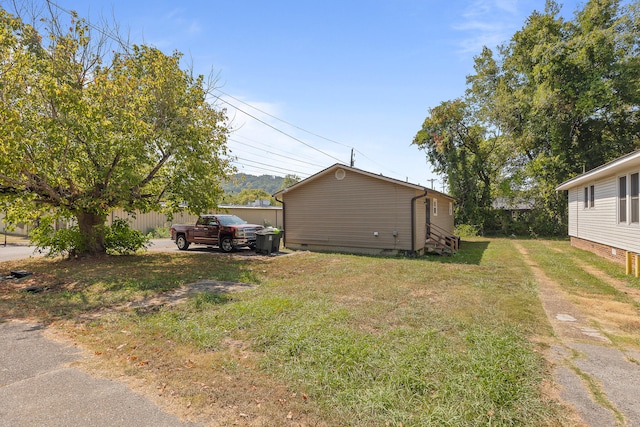 view of home's exterior featuring a yard