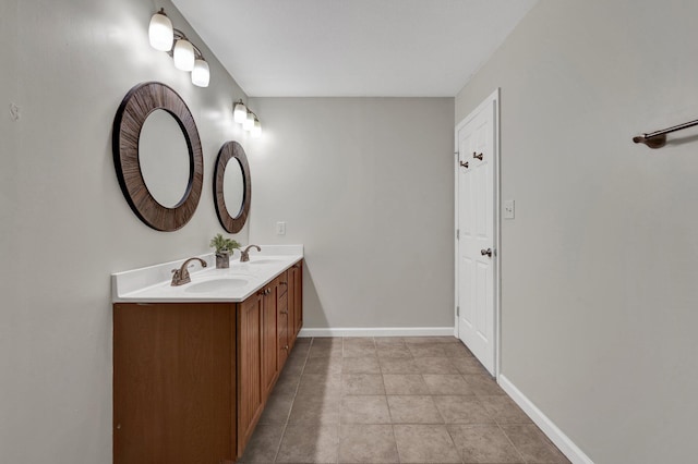 bathroom featuring tile patterned flooring and vanity