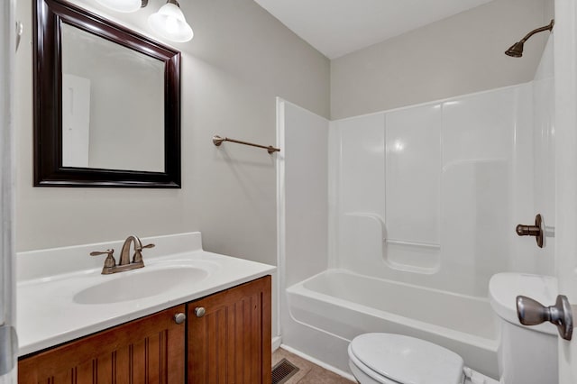 full bathroom featuring tile patterned floors, vanity, toilet, and washtub / shower combination