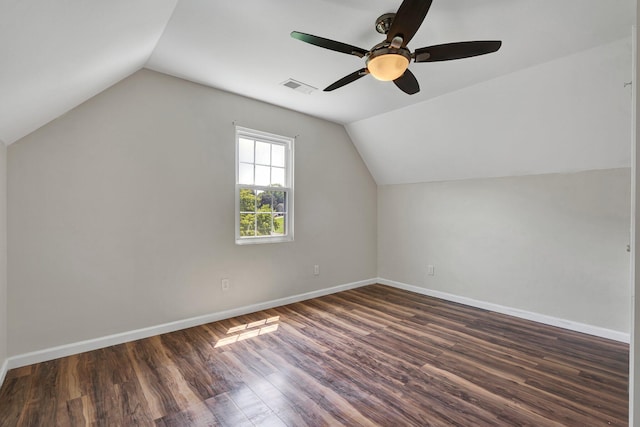 additional living space featuring ceiling fan, lofted ceiling, and dark wood-type flooring