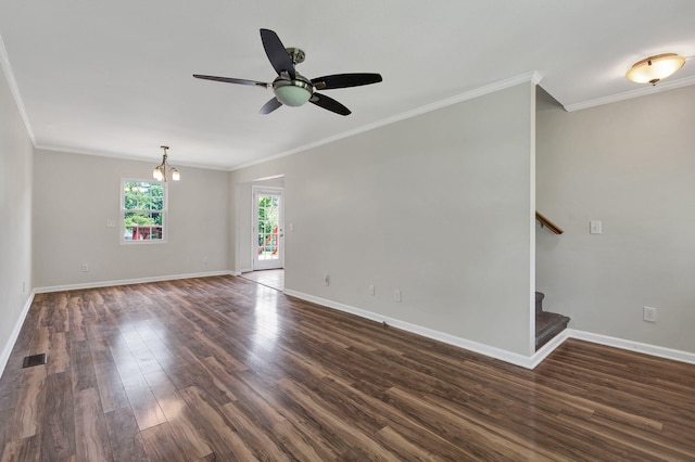 empty room featuring ceiling fan with notable chandelier, dark hardwood / wood-style flooring, and ornamental molding