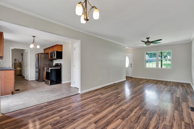 unfurnished living room featuring crown molding, water heater, ceiling fan with notable chandelier, and light wood-type flooring