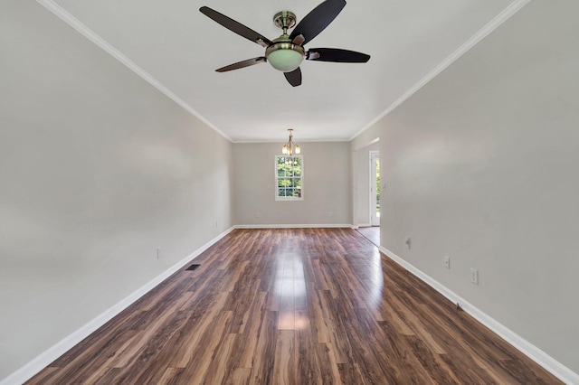 unfurnished room featuring ceiling fan with notable chandelier, crown molding, and dark wood-type flooring