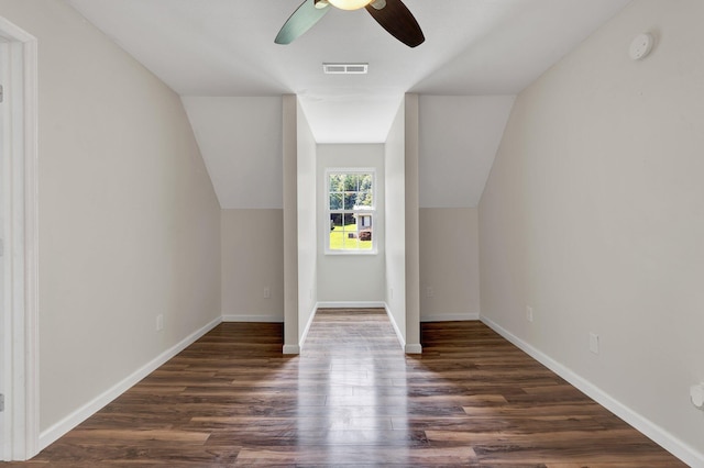 additional living space featuring vaulted ceiling, ceiling fan, and dark wood-type flooring