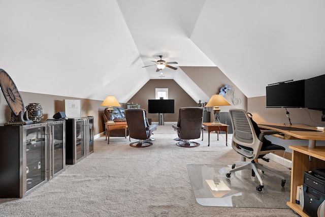 carpeted office featuring vaulted ceiling and ceiling fan