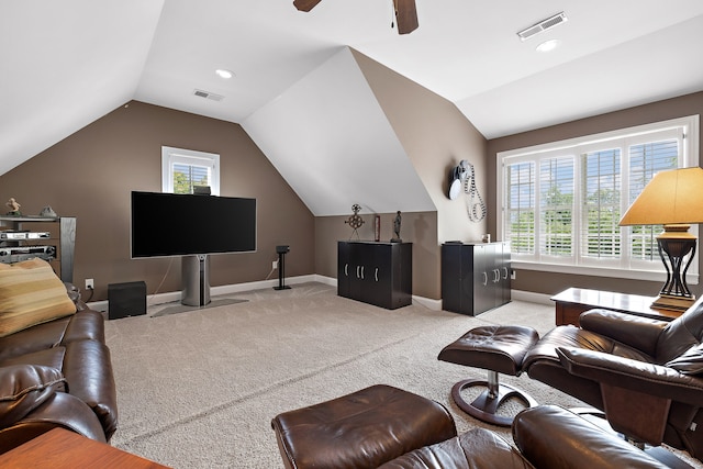 living room featuring ceiling fan, light colored carpet, and vaulted ceiling