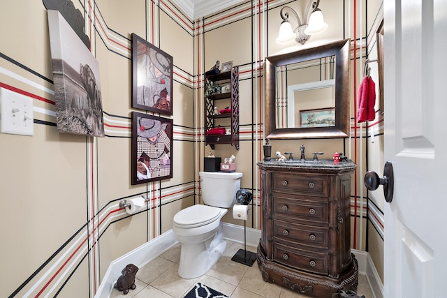 bathroom featuring tile patterned floors, vanity, and toilet