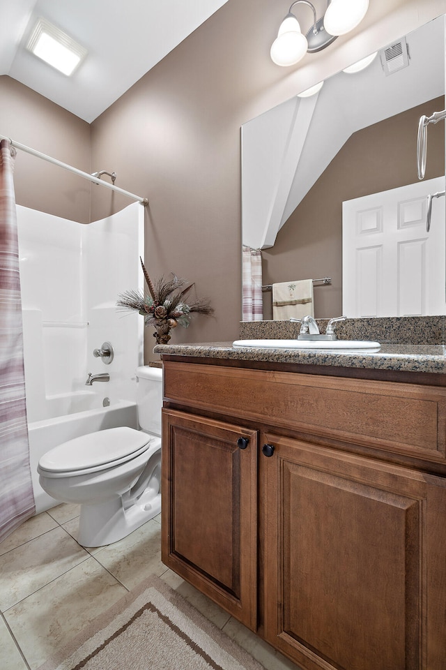 full bathroom with vanity, tile patterned floors, shower / bath combination with curtain, vaulted ceiling, and toilet