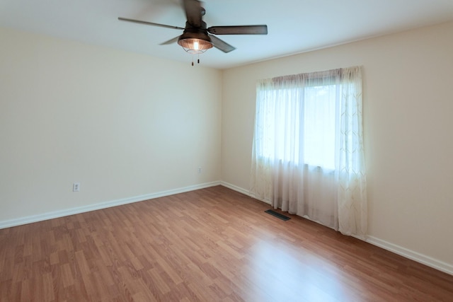 spare room featuring ceiling fan and light wood-type flooring