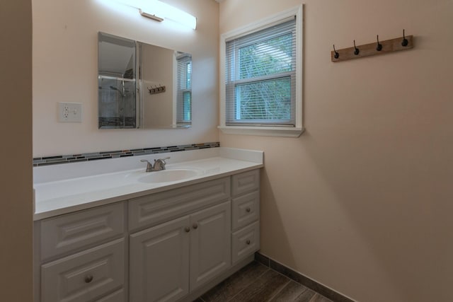 bathroom featuring vanity and wood-type flooring