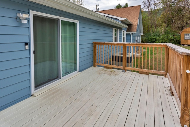 wooden terrace featuring central AC unit