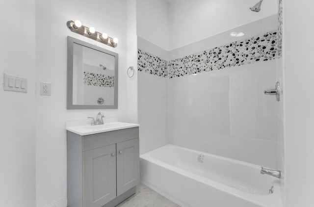 bathroom featuring vanity and  shower combination