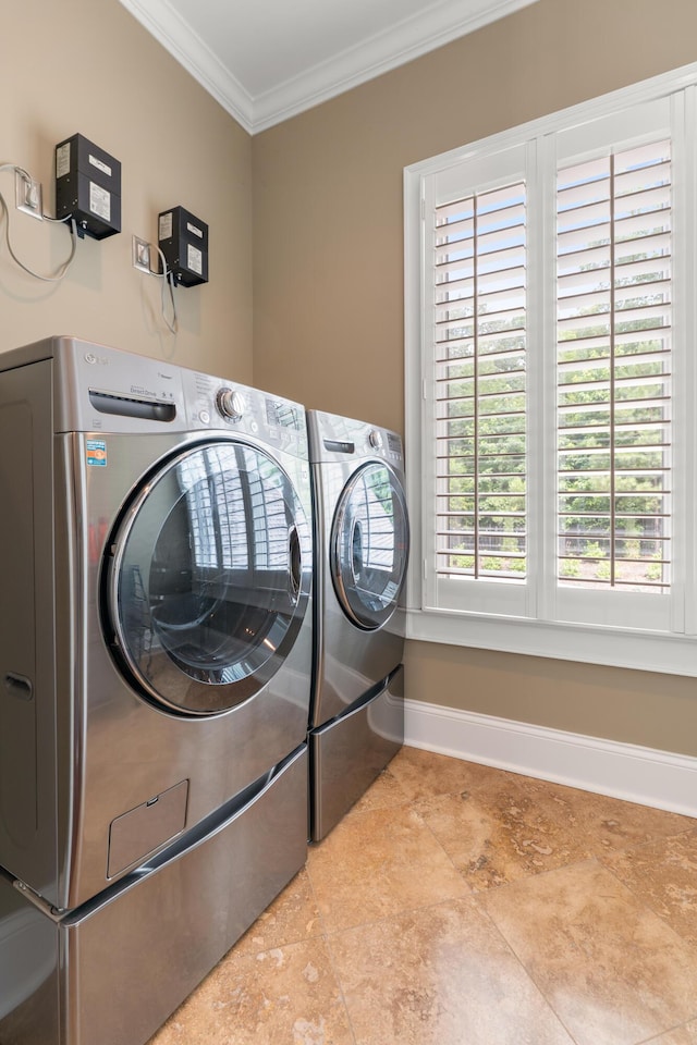 715 Pembridge Cir NW, Cleveland, TN 37312 - laundry room featuring washer and clothes dryer, ornamental molding, plenty of natural light, and tile patterned floors