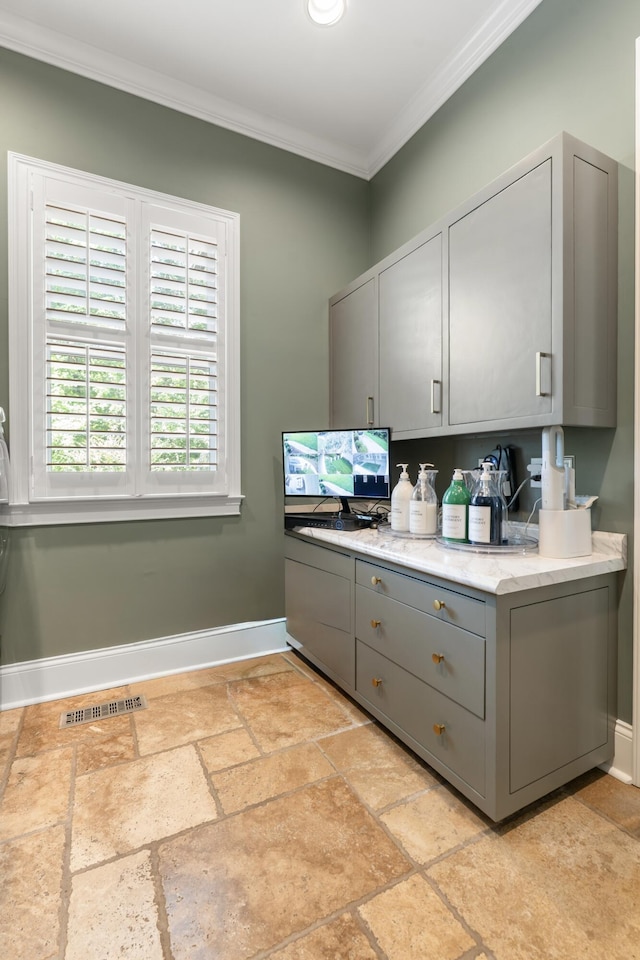 715 Pembridge Cir NW, Cleveland, TN 37312 - kitchen featuring gray cabinets, crown molding, stone tile flooring, and light stone countertops